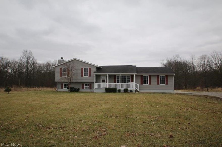 Very nice! complete remodel. New composite flooring and carpeting. Freshly painted throughout. All new stainless appliances. New counter tops. All new bathrooms.(flooring, sinks, toilets and tub. New decorative front door. Family room fireplace with stone accent hearth. Covered front porch with vinyl railing (6 x 24). Rear treated lumber rear deck (16' x 12') looking out to a huge back yard. Rear parcel H220010008813 1.848 additional acreage.  Possible Highland Schools (open enrollment if available).