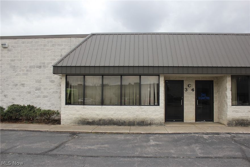 Office - 900 sq/ft  -- Warehouse 960 sq/ft with 12' overhead drive in door. 4 offices: 15x12, 12x10, 15x10, 9x12. Warehouse 36x36 - 2 restrooms, parking in front & rear of building. Close to I-480. Serving Akron-Cleveland markets. Ideal location for business.