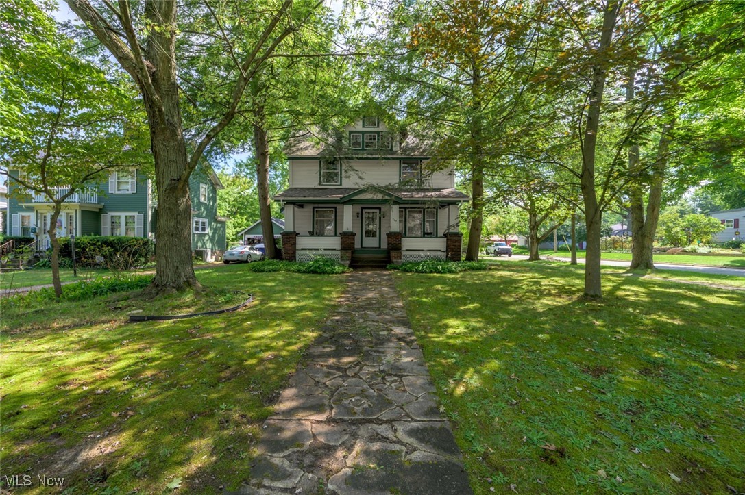 Welcome home to this beautiful 1758 square foot home with an additional 780 square foot, partially finished 3rd floor, situated in the Historic District of Ravenna on East Main Street. The large covered front porch is perfect for morning coffee or watching the parades march by, and the detached garage with a paved driveway off Liberty makes for easy access while enjoying the view of Main Street. This beautiful home boasts original woodwork, built-ins, spacious rooms, with 2 full bathrooms and 3 bedrooms. There are numerous bonus rooms that could make an additional 3-4 bedrooms, craft rooms, offices, and a basement workshop, anything to fit your needs! It is believed that the original hardwood floors are under all the carpeted areas. The roof, siding and kitchen have been updated, with a little love this home could be your dream! For peace of mind seller is offering a one year home warranty! Schedule your private showing today!