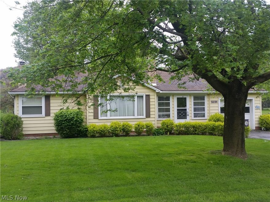 Consisting of a frame ranch home built 1951, with 900+ square feet. Enclosed front porch. Carpeted foyer with closet.  Kitchen with wood cabinets, microwave, and linoleum floor.  Dining area. Carpeted living room with bay window.  12x16 carpeted enclosed back porch.  Two carpeted bedrooms with closets.  Full bath.  Plaster finish and wood trim throughout. Original hardwood floors under carpet. Vinyl siding, and windows. Cement block foundation, Full basement. Oil heat.   Laundry. Gorden Bros. softener.  Lenox air cleaner. Electric hot water tank.  100 Amp electric box.  Fruit cellar. Attached garage with overhead door and opener.  20x30 pole building, wood sided with concrete floor, electric, and overhead door. 10x20 porta building with overhead door. Well and septic system.  All situated on .334 acre of land nicely landscaped with paved drive and mature hardwood shade trees.