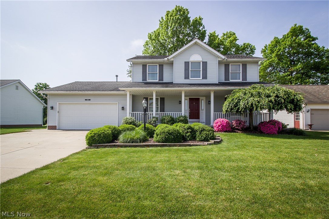 CLASSIC CENTER HALL COLONIAL IN UNIVERSITY VILLAGE! Fantastic curb appeal and a charming porch greet you and invite you inside where you'll find a living room and dining room with chair rail at the front of the home. Head into the kitchen with oak cabinets, matching white appliances, and breakfast bar. The large dinette includes a workstation and opens to the patio with views of the private backyard! The family room features neutral carpet, ceiling fan and gas fireplace with oak mantle, perfect for those chilly days. Around the corner, you'll find a guest bathroom plus 1st floor laundry that leads to the 2 car garage. Upstairs, the master bedroom offers a walk-in closet, storage closet and private bath with double oak vanity, garden tub, and walk-in shower. The other bedrooms share a full bath with tub/shower combo and linen closet, plus there's another linen closet in the hall. Tons of storage space in the 12-course unfinished basement or bring your ideas to finish for even mo