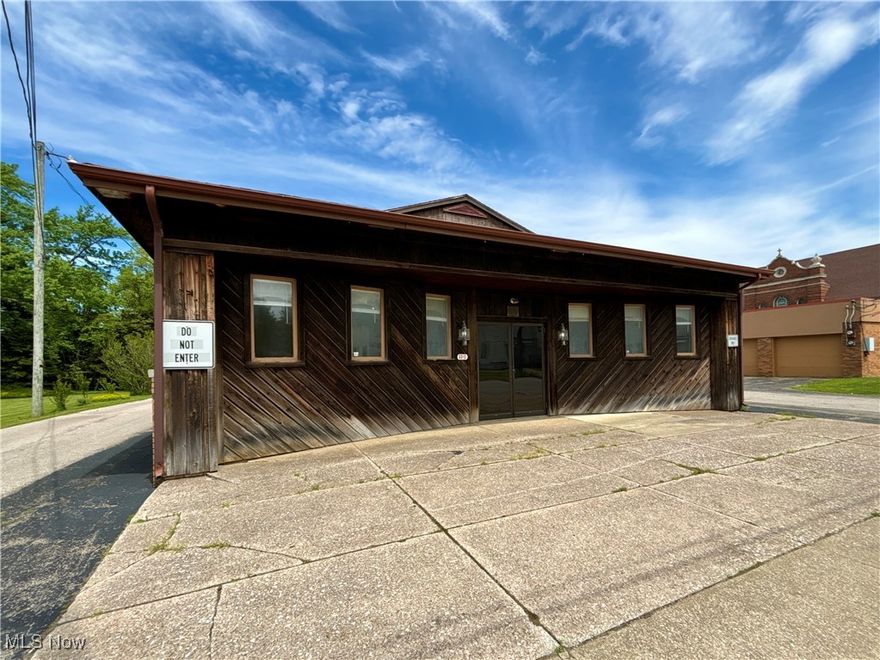 Situated in the heart of Ashtabula, this updated 2,262 sq ft free-standing one-story office building offers excellent visibility and accessibility for a variety of professional uses. Located only a half mile from the Ashtabula Regional Medical Center, 1 mile from downtown Ashtabula and 2 miles from the Historic Ashtabula Harbor - this commercial building is close to everything! Set on under a half acre lot, there is a dedicated asphalt parking lot in the back and two one-way shared drives on either side of the building. The flexible layout offers an number of generously sized offices and conference spaces, a back entrance and lobby with reception window, kitchen with break room, bathroom, server room, utility rooms and generous storage throughout. Interior highlights include beveled glass office doors, solid wood closet doors and lots of light. Bring your finishing touches to make this property the place where your unique business will thrive. Schedule a private showing today!
