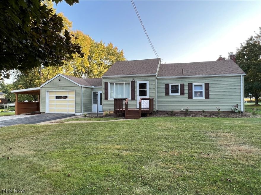 Charming ranch home in Jackson Township on a double lot with city utilities and loads of updates!  A rare find in this price range...must see the inside.  This home is move-in ready with new floor coverings, fresh paint and an attached multi-purpose carpeted breezway.  Currently used as a 1 bedroom home but was a two bedroom.  There is a family room or additional living suite bedroom at the rear of the house with luxury vinyl wood plank flooring and a fireplace (used for decorative purposes only...the wood burning insert was removed).  All new full bathroom with tub/shower enclosure.  Spacious kitchen with newer cabinets, countertops, vinyl flooring and is open to the living room area. Plenty of storage including a one car attached garage with a carport and a detached garage used for storage with access to the 14x13 covered back porch with carpet.  The basement is clean and well maintained with a utility tub, hook up for laundry and potential 13x22 rec-room with glass block windows and painted walls.  Beautiful backyard with firepit and light pole.  Gas heat, central air, city utilities.  Updates include; vinyl siding, new roof in Sept. 2020, new hvac in August 2023 and more.