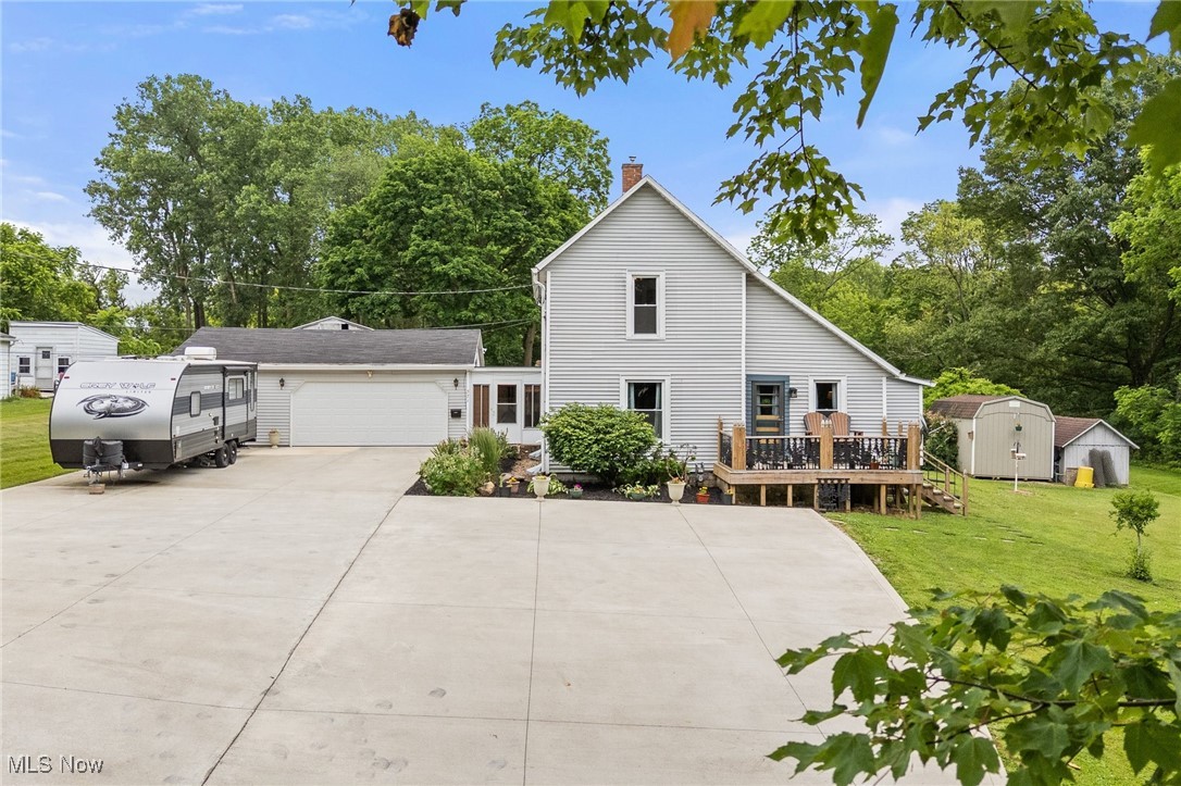 Welcome to this adorable 2-story home nestled on 4.7 acres, offering the perfect blend of open space and wooded privacy. With 3 bedrooms and 1.5 bathrooms, this home has a clean, down-home feel that’s both cozy and inviting. Inside you will find a warm and well-maintained interior with primary bedroom and laundry on the main floor. Outside, enjoy peace and beauty —an open yard perfect for play or gardening, with serene woods to the south adding privacy and natural charm. Unwind on the back deck, with a decorative pond that sets the scene for quiet mornings or evening relaxation. Recent updates include new roof and driveway (2021) new windows (2018) new front deck 2023. This property offers comfort, character, and room to roam. Don’t miss your chance to make it yours!