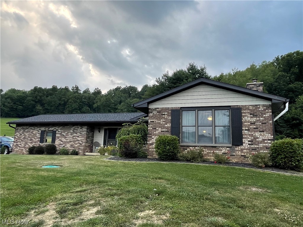 Country views! Craving some outdoor space? Brick and vinyl ranch situated just minutes from town, in Dover School District. +This 4-5 bedroom home has so much to offer! Main floor includes 3 bedrooms and 2 baths. Large family room opens to sunken living room with brick fireplace and newer woodburning insert & wall to wall bookshelves. Family room opens to the second patio space. Enjoy the master suite with walk in closet and master bathroom. Large vinyl deck, overlooking the backyard, is just off the kitchen. All kitchen appliances included but not warrantied. Lower level is finished with a massive rec room, and 2 bedrooms. It's plumbed & walls are up to add another bathroom (will need upflush toilet). On the exterior, you'll notice the newer roof, soffits, gutters and vinyl detailing. Two car attached garage and 10x10 storage shed. Frontier high speed internet. Well & septic inspection was done recently and approved by the health dept. Don't miss this gem!