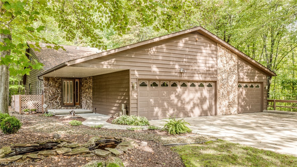 You will be One With Nature in this great Colonial on just over an acre* Beautiful yard feels like your in the metro-parks and you can enjoy relaxing on the deck or in the gazebo* Vaulted great room leads to the open kitchen with skylights and step down to the dining room with wall of windows to enjoy the view* Large family room includes fireplace* First Floor master suite has sliding doors to the deck and master bath includes vaulted ceiling with skylights, ceramic wall shower and corner tub* Other features include first floor laundry, nice sun room, 3 car attached garage* Call your agent today, to view this beautiful home*