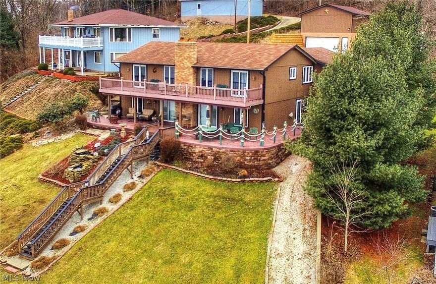 Lakefront Beauty situated on a point w/ 126 of lake frontage and elevated panoramic views of the lake. This spacious 4 bedroom, possible 5 bedroom home has everything you could want including a two story four car garage. Second master suite with a fireplace could also be used as another family room or a bunk room with a beautiful full bath with a walk in cedar closet. The living room has a frpl. w/insert and sliding doors to a huge stamped concrete patio. Perfect for entertaining and grilling! Dining area has a full wall with cherry built-in shelves and cabinets. The den also has built in cabinetry of wormy chestnut, plus a trundle/day bed making it functionally a 5th bedroom. The upstairs game room provides a second large entertaining area in addition to the main floor great room. Enjoy sunbathing and the gorgeous views from the full deck made from composite wood. LED accent lighting around the deck and down the composite steps add a nice atmosphere! No deferred maintenance or capitol