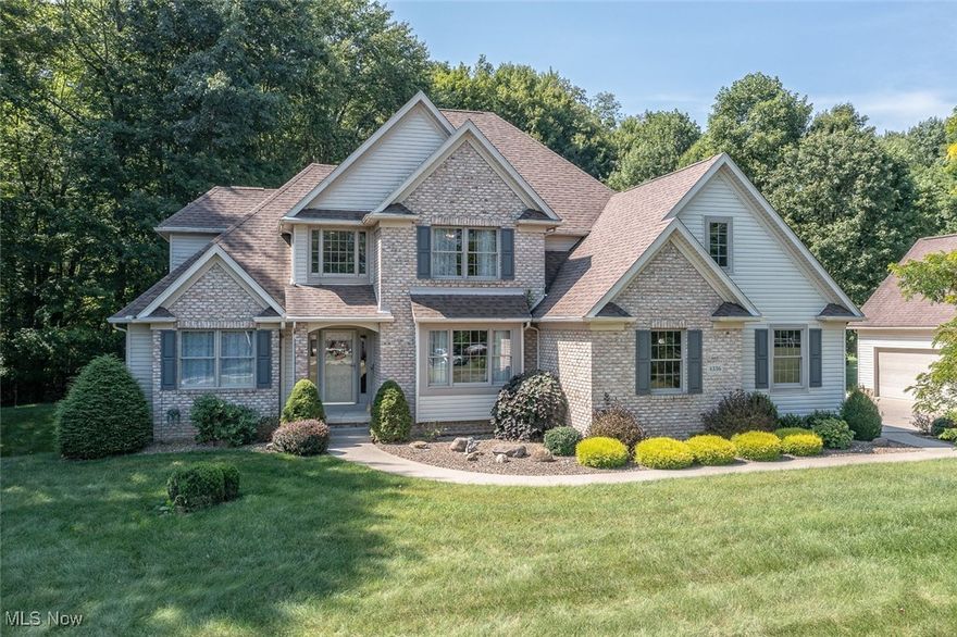 Welcome to this exceptional custom-built home featuring 3 bedrooms and 2.5 bathrooms, nestled on over 3 private acres. It includes a generous first-floor owner's suite, along with two to three additional bedrooms, a two-car-attached garage and an additional detached two-car garage all located in a peaceful neighborhood within the desirable Copley School District. As you enter, you'll immediately appreciate the quality craftsmanship throughout. The breathtaking wall of windows enhanced by the soaring ceilings in the great room connects the rustic outdoors with the welcoming interior, perfect for gathering around the beautiful fireplace to unwind, entertain, or host family and friends. The kitchen's custom oak cabinetry is extremely functional. A large island, ample storage, countertops, and walk-in pantry with electrical outlets allow you to use larger appliances right where they are! Between the kitchen and sunroom, the dining area features a beautiful custom-built hutch. As you pass through the French doors, you'll enter the sunroom, where breathtaking views of the property await, enhanced by vaulted ceilings and skylights. At the front of the house, an extra living room features French doors making it a perfect private space for a home office. Relax in the large owner's suite that features two walk-in closets and an adjoining bathroom with a tub, shower, natural light, dual sink and vanities for ample storage. A spacious laundry room and a guest bathroom complete the first floor. Upstairs, there are two large bedrooms, a bonus room that can serve as a fourth bedroom, storage room, and a full guest bathroom with two separate vanity rooms and a Jack and Jill shower. The lower level features an expansive walkout basement with limitless potential for extra living space, a workshop, or a gym. This gorgeous home combines comfort, space, convenience, and functionality. A pre-home inspection is available. Book your tour today to discover everything it has to offer