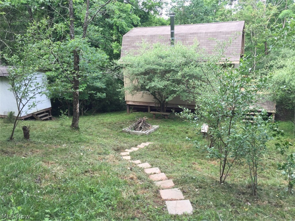 16 Acre hideaway near the Tyler/Doddridge County line. Newer cabin with private deck surrounded by nature. This would be a great hunting camp or weekend getaway.