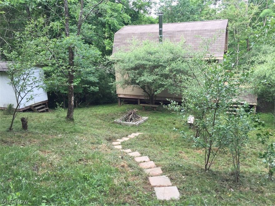 16 Acre hideaway near the Tyler/Doddridge County line.  Newer cabin with private deck surrounded by nature.  This would be a great hunting camp or weekend getaway.