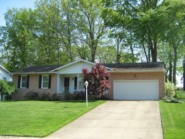 Move to Wyoga Lake Estates in time for summer fun and recreation! Well-maintained ranch in very desirable neighborhood. Relax on your 20 ft front porch or enjoy bird watching from your enclosed 12 x 14 back porch free of mosquitoes. Foyer entry with guest closet leads to living room opening to formal dining. Remodeled, eat-in kitchen with crown molding, Corian countertops, beautiful cabinetry and ceramic floor. Spacious family room features handsome bookshelf wall and a brick, woodburning fireplaced wall. Workshop, laundry and storage space galore in unfinished walk-out basement. Just minutes to Rt 8, Cuyahoga Valley National Park, many restaurants, etc.