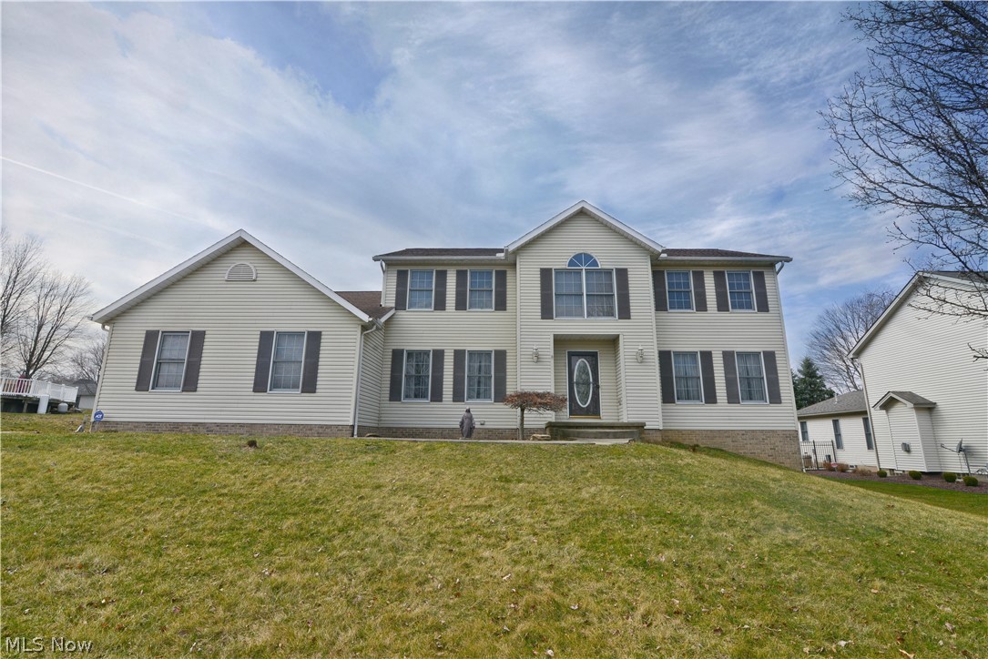 Beautiful, open concept home tucked into a quiet, cul de sac road in Struthers. The first floor plays host to a large, updated eat-in kitchen with granite counter tops and stainless steel appliances; 2 walk in pantries and an unobstructed view of the large eating area and family room. Formal dining room, foyer, media room and a first floor bathroom are all done in a neutral color palette. Recessed lighting gives the entire first floor a clean, modern look. The second floor has 2 spacious bedrooms with large closets, and a remodeled bathroom with 20x20 ceramic and a walk-in jetted tub. Master bedroom has a full bathroom with a separate tub for soaking, shower, linen closet, and walk-in master closet. There is also an attached loft that could make a great office or craft space. Tons of storage throughout this home for linens, clothing, seasonal decorations. The basement is almost entirely finished, offering a large bedroom, open rec room and a semi-open space that could be a playroom or