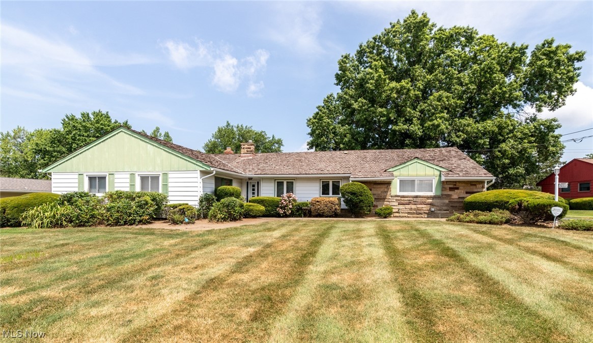 Bright and airy throughout, this exceptionally well maintained Ranch home offers single floor living at its best! Front Entry with slate floors opens to a sizable combination Living and Dining room with Mid Century Modern vibes including a flagstone fireplace, and a wall of windows overlooking the delightful screened Sun room! Oversized eat-in Kitchen has generous storage space, convenient planning desk, and built-in glass display shelving plus room for a full dinette. A dedicated Office with sliders to Sun room plus direct access to the yard offers the ideal work from home setup. Ample Primary suite has en-suite full Bath with step-in stall shower. Two additional Bedrooms share a full Bath in hall. Huge Laundry room off Kitchen has utility sink plus large storage closet, access to two car garage, and a convenient half Bath. This home sits on nearly a half an acre of unbelievably manicured and beautifully landscaped plantings and shrubs. The private patio offers a peaceful, park-like setting for your own backyard retreat!! Beachwood amenities include Walking Trails and Dog Park, Aquatic Center and New Playground, shopping, dining and highway access. Award winning Beachwood Schools! Don’t miss this stylish and spacious charmer!!