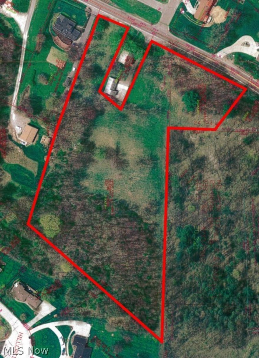 5.7+/- acre setting just close to town.  New Philadelphia city water and sewer available.  New Philadelphia Schools.  Two sections of frontage total approximately 390'+/-.  Excellent building site.  Country setting with city conveniences.  Parcel numbers 43-03017.000 & 43-03016.000.