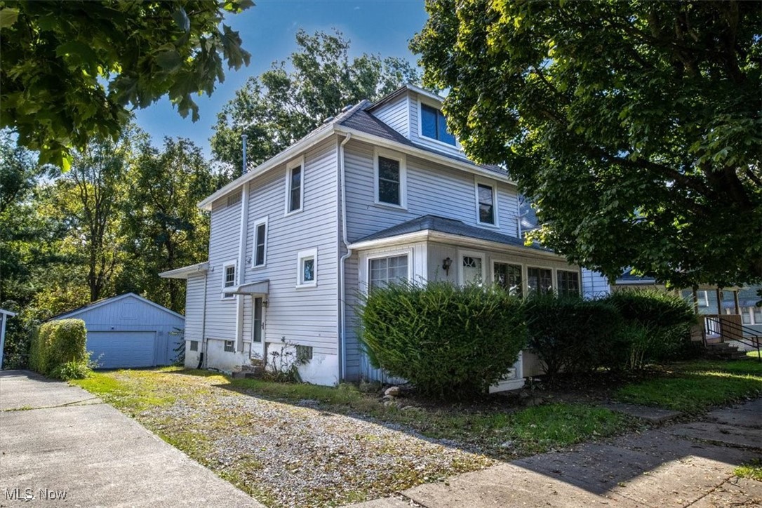 This delightful colonial home at 1244 Florida Avenue in Akron, Ohio, built in 1923, perfectly blends classic charm with modern updates, making it an excellent opportunity for both homeowners and savvy investors. Spanning 2,312 sq ft, this home offers a spacious layout with either 3 or 4 bedrooms and 2.5 bathrooms. The first floor is thoughtfully designed, featuring a welcoming finished front porch, two comfortable living rooms, a dedicated dining room, and a generously sized kitchen. Adding to its versatility, the property boasts a fully finished walk-out basement complete with a wet bar and another full bathroom, providing ample space for entertainment or additional living quarters. You can enjoy peace of mind with recent updates, including new vinyl siding, a newer water heater, and a newer furnace. Practical amenities include a private driveway and a detached two-car garage for convenient parking. Currently rented at $1600/month (with potential for higher rents) and tenants covering all utilities, this home presents a solid investment opportunity. Comfort is ensured year-round with central air and forced-air gas heating.