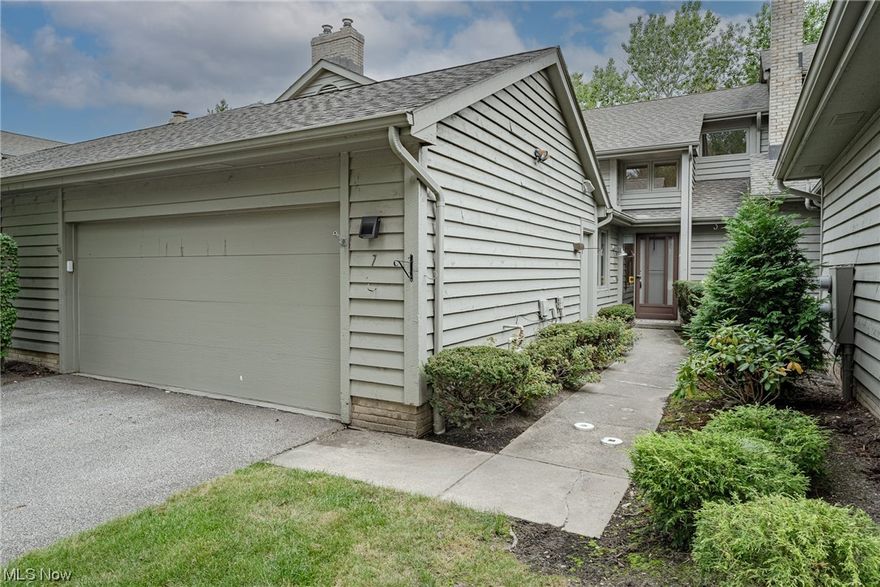 Move right into this extensively updated townhouse in The Village! This lovely home features 2182 square feet of living space with 3 bedrooms, 2.5 updated bathrooms, spacious open living areas, crisp neutral paint, a beautifully renovated kitchen, and more! The front door opens into a welcoming foyer area that flows into the kitchen and great room. The great room boasts a soaring vaulted ceiling, a brick fireplace, a bar with a quartz countertop, a dining area, and a sliding door to a private back patio. The completely renovated kitchen includes a full complement of stainless steel appliances, granite countertops, and a lovely tile backsplash. Off of the kitchen is a delightful bonus room with skylights that fill the space with sunlight. The first-floor primary bedroom features updated LVP flooring, a walk-in closet, and an updated ensuite full bath. A powder room off the foyer and a laundry room off the bonus room complete the first floor. Upstairs, there is a very spacious loft with