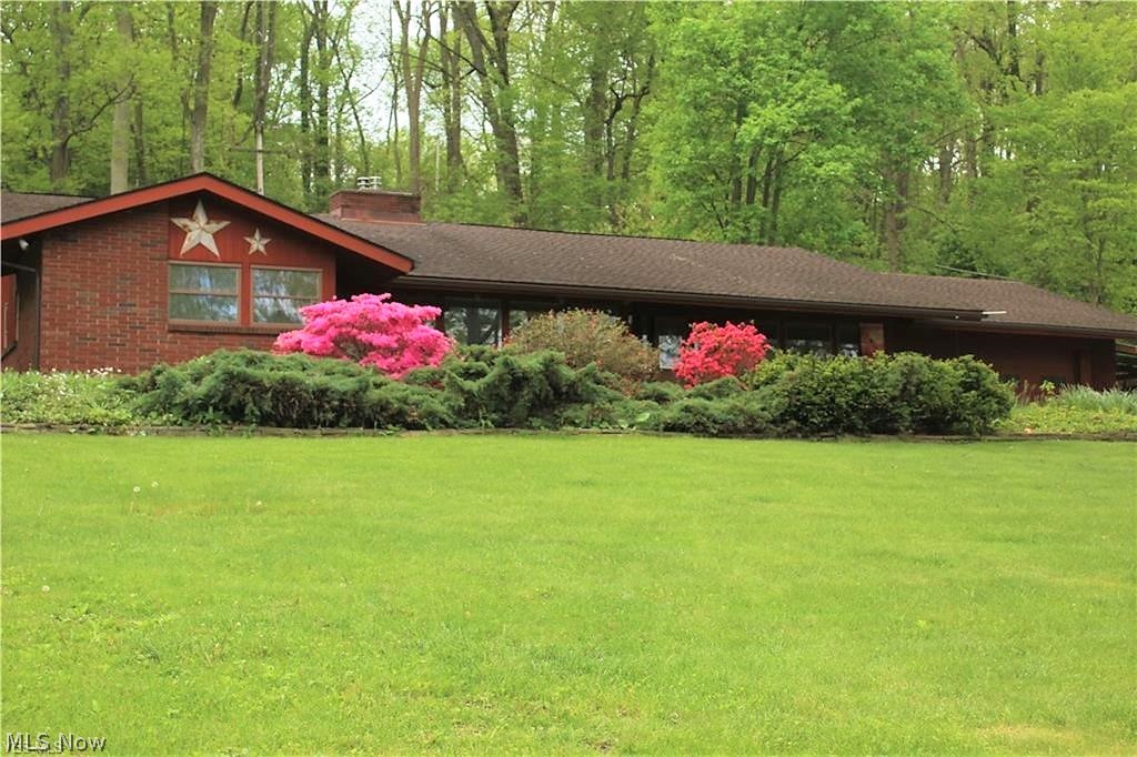 Welcome home to this spectacular three bedroom, three full bath ranch home offering stunning landscaping. Come on into the large living room that offers so many windows to let the natural light shine through, there is new carpet (2020), and has been freshly painted (2020) through out the home. There is a double fireplace from the living room and family room with wood burner insert. The family room is plumbed for surround sound, great for studio, entertaining etc. There is a dining room that has wall to wall windows offering so much more sunlight. The large kitchen is a chef's delight offering so many gorgeous cabinets and counters, stainless steel appliances with Viking range, vented hood, double oven. Off to the side back door there is room for a small table. So much room and storage in this home. The large laundry room offers a counter and cabinets for more storage. There is three bedrooms, three full bathrooms, one of the bathrooms has a double sink. All this on one level. The large