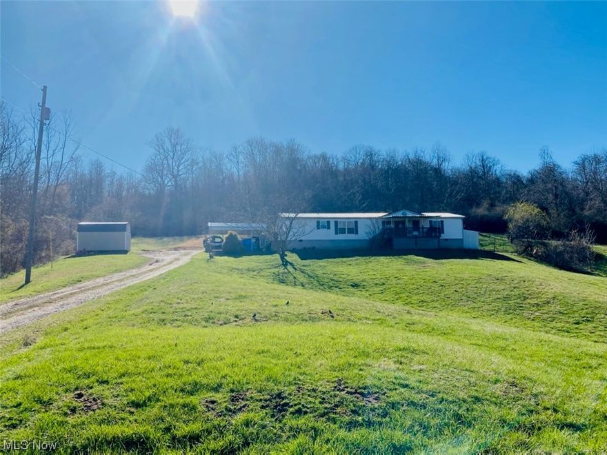 Looking for acreage? Almost 12 acres with this 1836 square foot double wide home. Open floor plan has a carport for covering your vehicles. Secluded. Built in 2004. Metal roof. 3 bedrooms, 2 full baths. Needs some TLC.