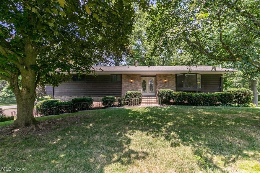 Welcome to this charming raised ranch that has over 2,000 sq ft of living space in Stow. Large family room with a beautiful bay window that allows for the sun to shine in. The living room also boasts a vaulted ceiling and an electric fireplace for those cold winter nights.  A sizeable kitchen with adjoining eating area, with tons of cupboards for storage, and also a nice island for sitting. From the kitchen step out to the enclosed three season room overlooking the backyard which makes a perfect spot for relaxing. There are 3 generously sized bedrooms and 2.5 baths. The master bedroom has an ensuite bathroom and walkout deck. The lower level of this home has a completed finished area, perfect for a kid’s rec room, man cave, or second living room and walks out to a covered porch and patio that is perfect for all your entertaining. Additional bonus to this great home is the fantastic 3 car garage and extra storage shed on this large wooded corner lot!