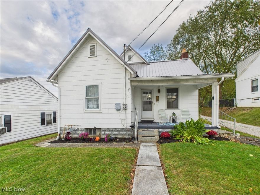 Welcome to this inviting cottage full of warmth and character! Step inside to discover stylish new flooring throughout, a beautifully remodeled kitchen with modern finishes, and a refreshed bath that blends charm with convenience. Recent updates include a new metal roof, new electrical and plumbing systems, new lighting and paint, and a newer HVAC system and hot water tank—all providing peace of mind for years to come. The full unfinished basement offers excellent space for a workshop, storage, or laundry area. Outside, enjoy the deep backyard that feels private thanks to a non-through alley behind the home. This is the first time this home has ever been on the market, making it a rare opportunity to own a thoughtfully updated cottage that maintains its original charm while offering modern comfort.