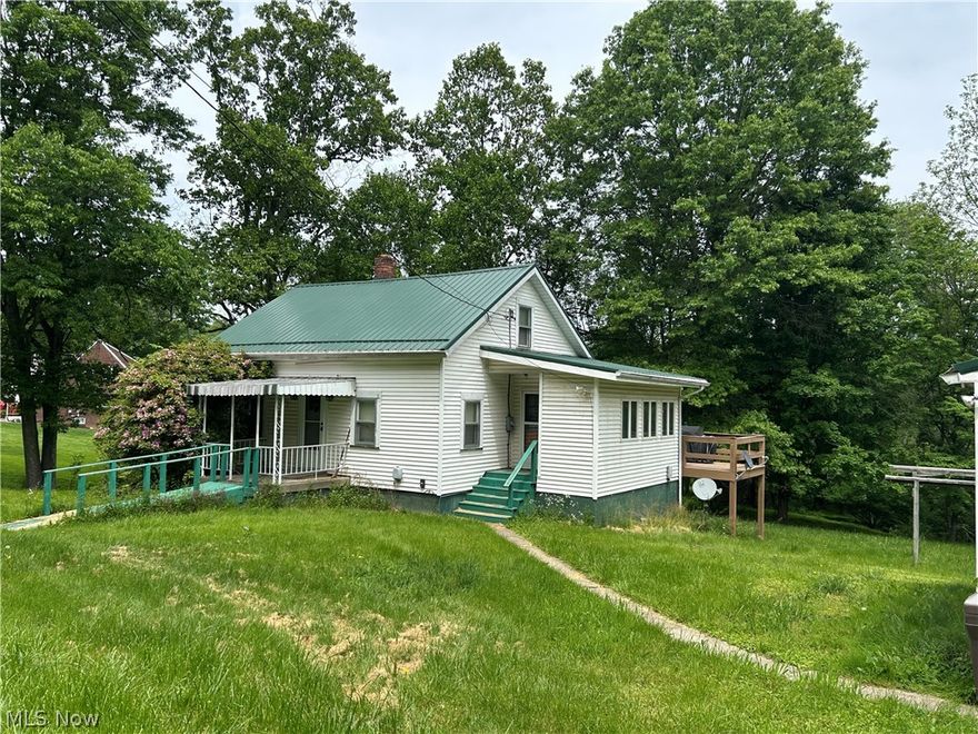 Escape to your own slice of peace and possibility with this unique home setting on 2 acres. Amenities include 1st floor bedroom, dining room, & laundry room plus bonus bedrooms & 1/2 bath on 2nd floor. Perfect for nature lovers, hobbyists, or anyone seeking space and privacy, this property offers it all. Step outside and enjoy room to garden, explore, or simply relax. A standout feature of this property is the dedicated observatory, ideal for stargazing, astrophotography, or quiet nights under the sky. Property  offers 3 garages, large outbuilding, and large deck overlooking acreage. The home is in need of some updates & TLC, making it a great opportunity to add your own style and value.