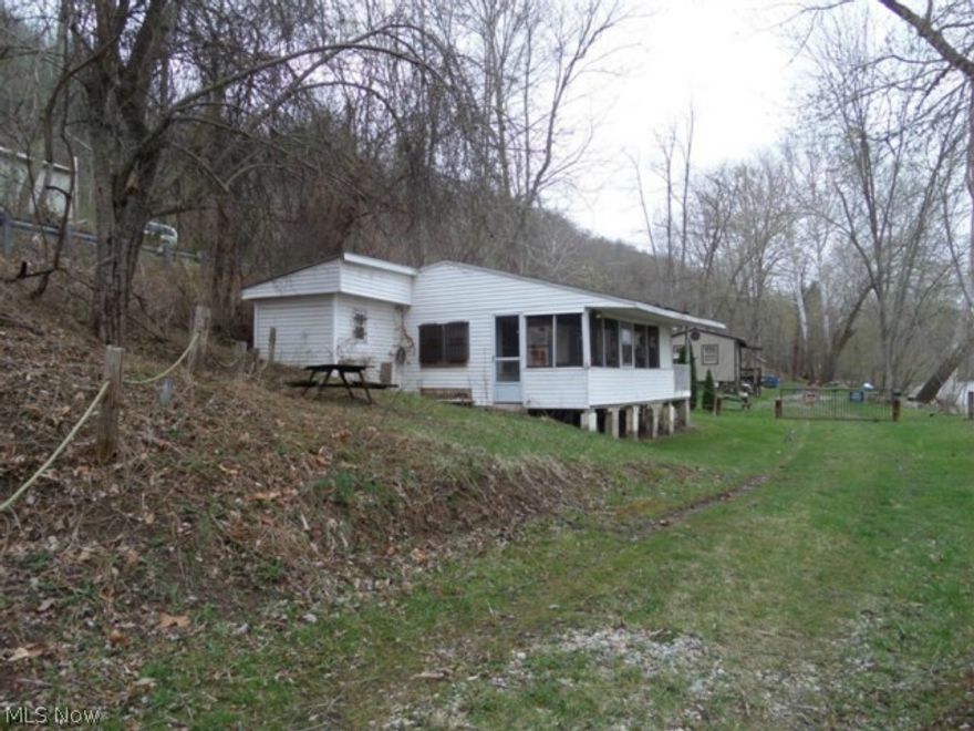 River Cottage located right on the Muskingum River. This cabin needs a little tlc but with some work would make the perfect weekend get-a-way!