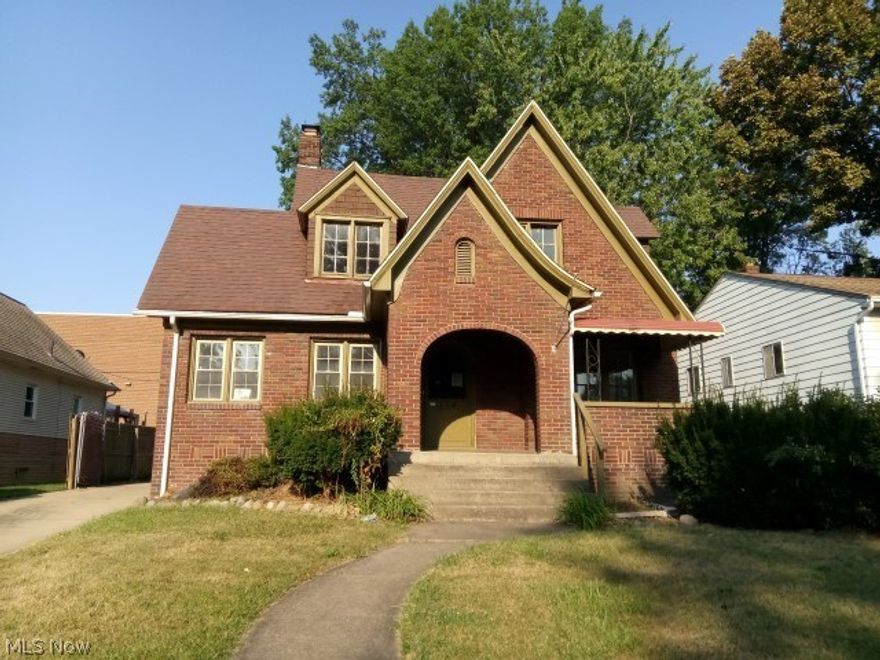 Three bedrom all brick Tudor home with lots of potential.  Kitchen offers eat in area, and an attached DR.  LR is spacious with FP.  Sunroom w/southern exposure affords lots of light.  Charming arched entries into all rooms.  Nice size BR's.  Fenced, private backyard.  Needs TLC.  Property sold AS IS.