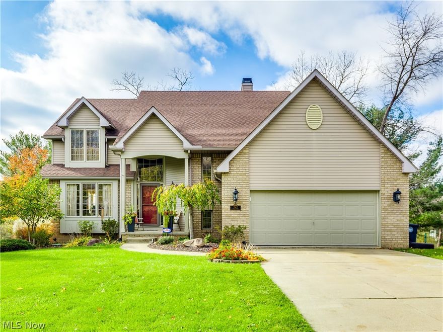 Welcome to this inviting custom built colonial home,  perfect for raising a family or for entertaining.   This home has had one caring owner and is in pristine condition with many updates.  The kitchen was updated in 2012 with white cabinets, stainless steel appliances and granite counters.  The kitchen shares a double sided  gas fireplace  with the sunken family room.  From the kitchen walk out onto a composite deck (16' X 36') that was replaced in 2015.  The half bath off the foyer was remodeled in 2012.  The upstairs has the master suite at one end with a newly remodeled bathroom in 2019.  The other 3 bedrooms and bath are at the other end of the hallway. The walk out basement has a recreational room, storage areas and a half bath.  The rec room has a gas fireplace with a blower.    The new slider door installed in 2015 walks out to a patio.  In 2019 the furnace and air conditioner were replaced.  It is located in the Woodridge School system.  This is a must see, move in ready, it w