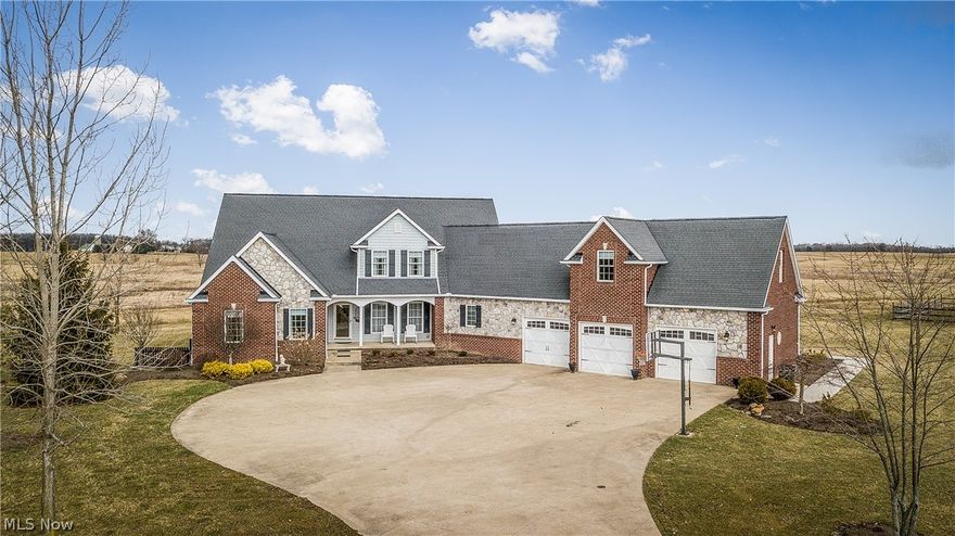 Here is what you have been waiting for - Fabulous trendy home - land for the family and animals too - North Canton Schools!  So much space offered in this 5br, 3 full and 2 half bath home sitting on 5 beautiful acres!  Super cool open floor plan with large foyer entry - all open and spacious to formal dining area - amazing kitchen - gathering area and on to the sunken great room with fireplace!!!  This amazing open floor plan is sure to please!  Lovely custom trim and updated flooring - gourmet kitchen with beautiful glazed Mullet cabinetry, hard surface counters, an extra large lunch bar with lots of seating - many extra details - well thought out!  1st floor master suite with lots of closet space,  bright and cheery master bath with double vanities soaking tub and separate shower.  Convenient sun room/office is located off the kitchen with access to patio and lots of outdoor space!  2 staircases to second level with 4 more bedrooms! 5th br could be a great bonus or exercise room. Ove