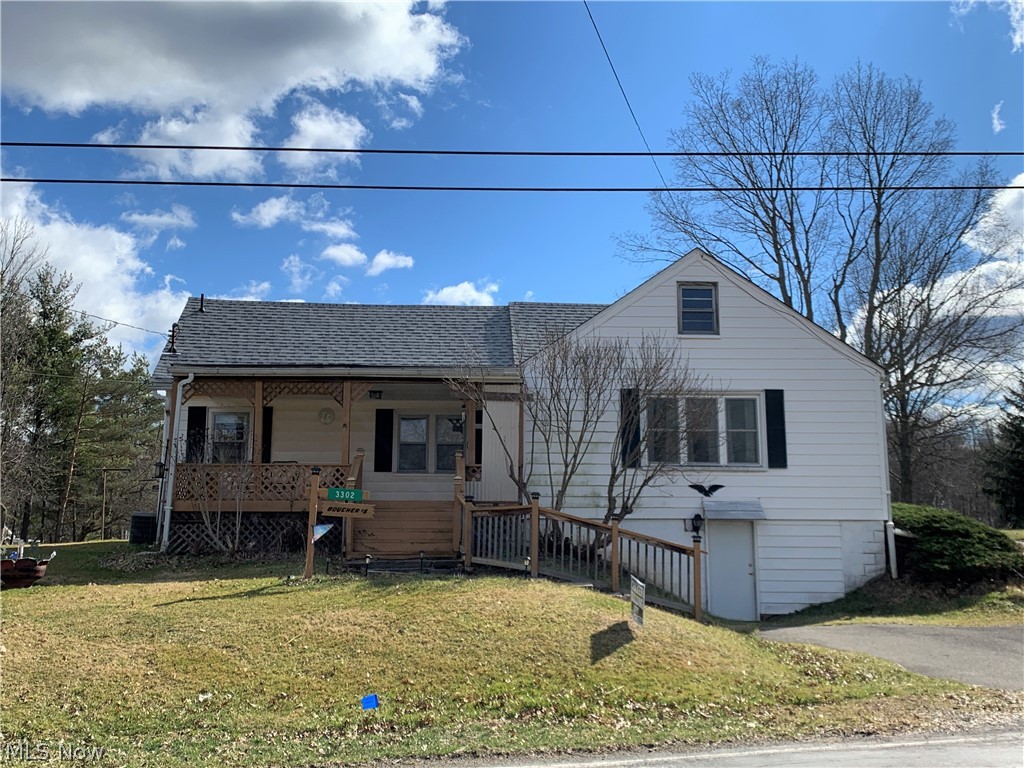 First time offered on the darling 2 bedroom home. Large living room and dining room. Updated fully equipped kitchen with abundance of cabinets and small eating area. Both bedrooms are nice size, with hardwood floors and nice closet space. Upstairs had bedrooms at one time. Nice welcoming front porch and enclosed back patio. You also have a 3 car garage. This one has a lot to offer and won't last. Recently updated; BB, furnace and a/c, water tank, roof and front porch. Septic will be approved.