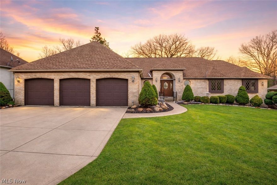 Welcome to 9421 Rainbow Lane in North Royalton, a home rich in character and timeless charm, set against a striking brick exterior with undeniable curb appeal and an attached three-car garage. This is a home that feels both classic and thoughtfully enhanced, offering a warm, inviting presence from the moment you arrive. Step inside and you’re greeted by an expansive living room, where large windows pour in natural light and a fireplace creates a cozy focal point. The space flows effortlessly into the formal dining room, where glass doors open to a beautifully designed, fully covered Trex deck with a ceiling fan, creating a seamless connection between indoor living and outdoor enjoyment. The kitchen carries a traditional yet functional feel, complete with a center island, space for casual dining, sleek appliances, and a built-in oven and electric cooktop with a hood vent.  The primary suite feels like a private retreat, offering generous space, a fireplace, ample closets, and an en-suite bathroom highlighted by a jetted jacuzzi tub. The additional bedrooms are equally welcoming, each offering comfort and charm with access to a shared full bath. The true standout of the home is the fully finished walk-out basement, designed for gathering and entertaining. With a full kitchen, separate wet bar, fireplace, dance floor, and direct access to the lower patio, it feels like an extension of the home rather than an afterthought. Recent updates to the basement include new cabinetry, ceiling tiles, dance floor, and dishwasher, that elevate the space even further. With a custom cedar closet in the garage, new roof in 2024, and hot water tank in 2025, this home offers a unique blend of classic style, personality, and modern functionality.