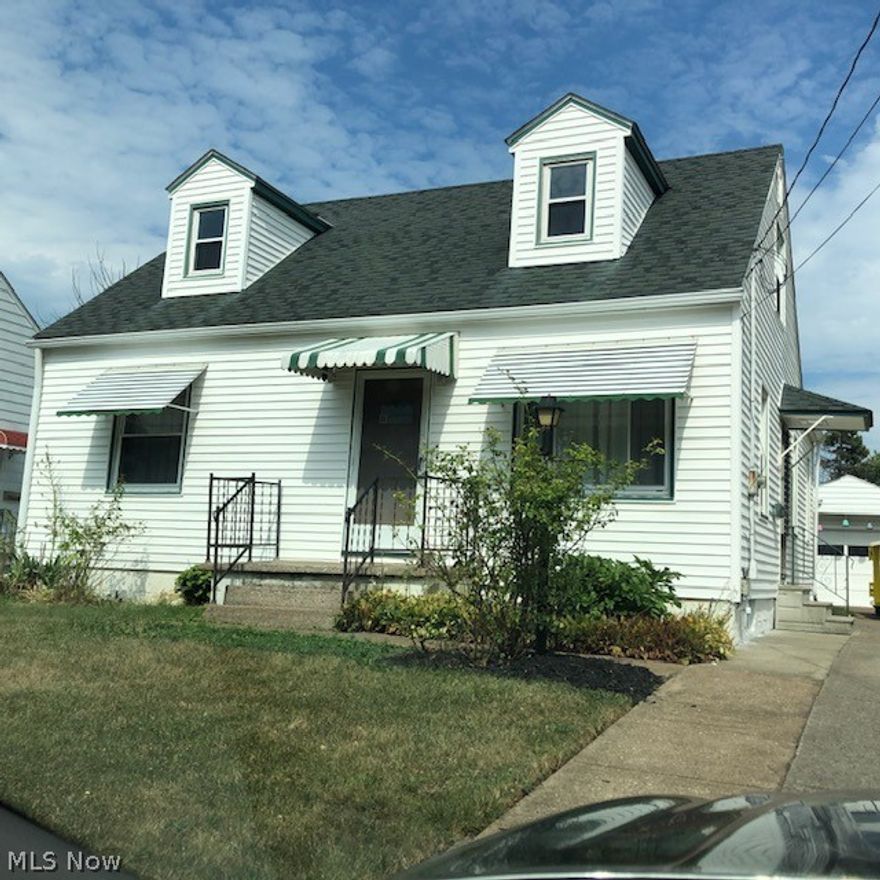charming cape (bungalow) has been well maintained. vinyl siding, thermo-pane windows.  Freshly painted interior with hardwood flooring recently refinished. Large 2nd floor bedrooms has built-in drawers and closet space and could be huge Master Bedroom. Partially finished basement has bar, vinyl floor covering and knotty pine paneling.  Asphalt shingle roof installed approximately 2006.  1 car garage has attached storage shed provides extra space for lawn equipment.  This charming bungalow is ideal for First time buyers or one to downsize to.. and is within walking distance to Lake Erie and parks.