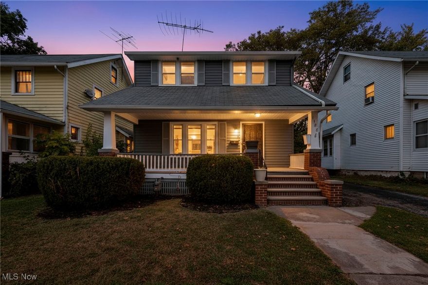 Charming and move in ready! Welcome home to this spacious, light-filled, and beautifully updated colonial situated on a quiet, desirable street of well-cared-for homes. Enjoy relaxing mornings or peaceful evenings on the charming front porch, or take advantage of the convenient garage and partially fenced yard for added functionality. The exterior features a freshly refinished and repainted steel siding for durability and curb appeal. Inside, you’ll find a updated warm, inviting interior highlighted by premium hardwood floors and newer vinyl windows for year-round comfort and energy savings. The heart of the home is the stunning 2023 custom white shaker-style kitchen, thoughtfully reimagined with 42” soft-close cabinets, added counters for extra workspace, and premium stainless appliances—including a dishwasher. Upstairs, enjoy three generous bedrooms, each with ceiling fans and rich hardwood flooring, plus an oversized full bath and a private 2nd-floor balcony for added charm. The full open basement offers endless possibilities for storage or future expansion. Recent updates also include a new hot water tank (2023) and numerous modern touches throughout. A truly beautiful home inside and out—easy to show and available for immediate occupancy!