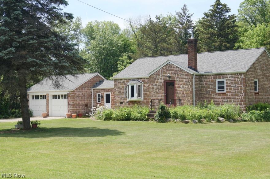 Peaceful country living right near the city. Enjoy this partially wooded 5.4 acres of land that runs up to the Rocky River. This is a great one floor ranch. This home has been in the family since construction was started in 1948 by Virgil Dolamore. The home features a circular driveway. Inside you will find that counters have been redone with solid stone. The windows are all newer from the Stanek window co. Enjoy the sunsets out in your glass enclosed three season porch or go sit around the fire pit. The home has been professionally water proofed and comes with a transferable warranty. There are two new Zoeller sump pumps with battery back-up. Freshly painted throughout.