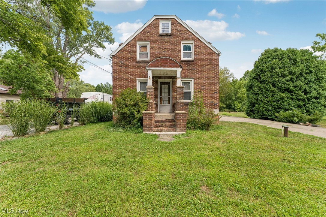 All-brick Cape Cod full of charm! Living room with wood-burning fireplace and neutral carpet. Formal dining room with bay window and oak hardwood floors. Kitchen offers oak cabinets, good counter space, and storage. Upstairs features three bedrooms including a spacious master with slider to raised deck and large walk through cabinet. Full basement, attached one-car garage with carport. Nearly an acre on a quiet dead-end street backing to woods.