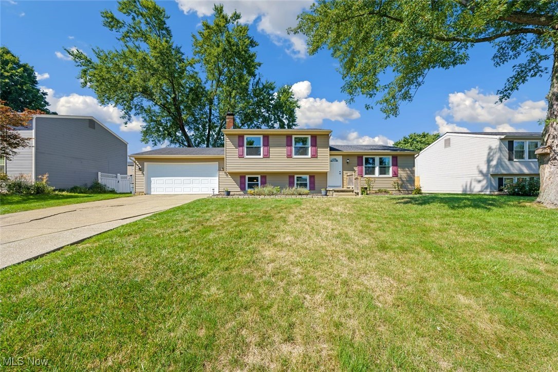 Welcome to your new favorite space! This split-level home is a perfect blend of charm and functionality, designed with a cozy, inviting atmosphere that feels just like home. As you step inside, you’ll notice the natural light pouring in, highlighting the newer beautiful LVP floor that flows seamlessly throughout the home.One of the standout features is the custom built-ins that add character and also provide practical storage solutions. The living area has a super cozy feel, perfect for gathering with loved ones. The layout , makes it easy to entertain or simply enjoy a quiet evening. The lower level family room has been thoughtfully renovated including updated wiring, insulation, newer windows and powder room. The layout flows seamlessly, making it easy to entertain or simply enjoy a quiet evening. The kitchen, a true heart of the home, boasts modern amenities blended with rustic charm. The kitchen comes complete with newer appliances,(approximately 3 years old) including a stainless steel stove, refrigerator, dishwasher, and large farmhouse sink. Upstairs, the bedrooms provide a serene retreat, each thoughtfully designed to maximize comfort and relaxation. The bedroom closets boast custom made closet organizers. The beautifully updated main bath completes the upper level of this home. The attached garage is heated, and has a dedicated 100 amp service for all the hobbies! Tucked away under the main level of the home is a great crawl space for seasonal storage. The large deck overlooks the spacious backyard that offers great space for outdoor entertaining and fun! This split-level gem is not just a house; it’s a place where memories are made, laughter is shared, and love fills every corner. You’ll find that it captures the essence of what makes a house a home. Please see the supplements for a list of updates.