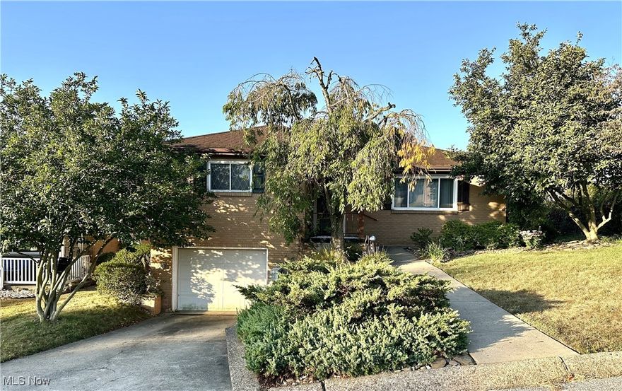 Tucked away on a quiet dead-end street yet close to everyday conveniences, this well-maintained 3-bedroom, 2-bathroom brick ranch offers the best of both comfort and location. The beautifully landscaped front yard adds great curb appeal and welcomes you home. Inside, you’ll find a spacious formal dining room, an eat-in kitchen with updated stainless-steel appliances, and a large living room with expansive windows and direct access to the deck—perfect for relaxing or entertaining. Cozy up by the wood-burning fireplaces in both the living room and the lower-level rec room - just in time for the holidays! This home blends warmth, space, and functionality in a peaceful setting, making it a wonderful place to call home. Don’t miss the chance to make this property yours!