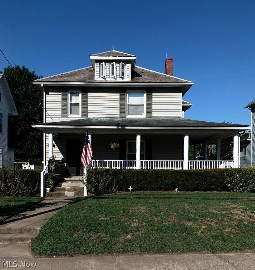 This home has many updates and move-in ready.  First level offers foyer with original wood banister, flows into living room with original mantle with decorative fireplace and open to formal dining room with door to front porch - all these rooms have original, beautiful hardwood floors that were just refinished along with original pocket doors.  Kitchen has been nicely updated with custom oak cabinets, stainless steel appliances, island and leads you to back covered porch (could be screened in).  Second floor offers 4 bedrooms with one having steps to walk up attic, and lots of closet space - bedrooms offer wood floors under carpet.  Full bath with walk-in shower on first floor and full bath with large soaking tub/shower on second floor.  Oversized lots offer original carriage house with 2nd level and a 2 car garage.  Updated electric panel, newer replacement windows, wrap around porch and so much more.