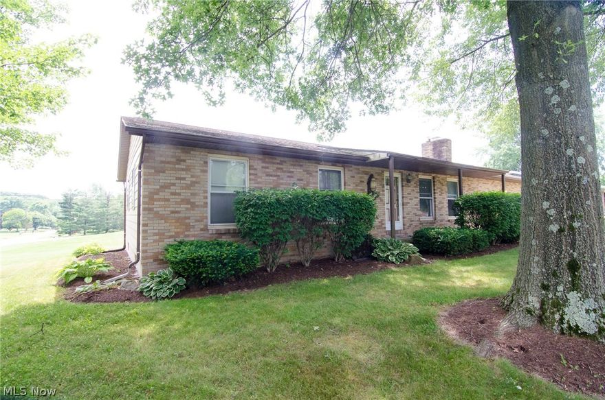 Corner lot Ranch in Green!  Located on a nearly half acre lot, this Pleasant Hills Estates home is just what you have been waiting for.  Entire home has brand new carpet and lots of fresh paint.  Living room features a gas fireplace with a brick mantel.  The dining area opens up the kitchen with newer laminate flooring.  The sliders lead out to the enclosed sun porch with a hot tub, that stays.  There is a master suite, 2 additional bedrooms and another full bath on the main level.  All bedrooms and dining area have ceiling fans.  Head down stairs to check out all of the additional living space.  There are 2 areas to use as family/media/recreation space plus a bonus bedroom or office. The huge utility area provides tons of storage and a laundry area.  Attic access through coat closet off of the living room.  This home also has a 2 car attached garage and pluming for a 3rd bathroom on the lower level.  Roof 15 years, gutter guards, 40 gallon water tank 2 years, ductwork recently cleaned