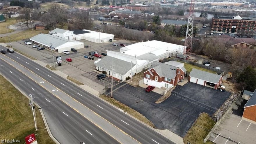 Prime Commercial Real Estate W/ Rentals - Jackson Twp. - Stark County – Belden Village Area – High Traffic Area - Features several well-maintained buildings on 3.48 acres. Presently leased or rented, plus cell phone tower lease. Well diversified commercial units encompass light manufacturing, retail sales, professional services, heated storage units, offices, fitness center, and warehouses. 100% occupancy with 13 commercial tenants occupying 27 units. Home has 3 apartments with private entrances and separate enclosed garages. Plus, cell tower income. The current annual gross income is $208,680. Taxes per half year are $19,797.65. 100% occupancy, Several long-term tenants up to 40 years, Potential tower expansion with shared revenue, Duplex apartments over commercial units, 2022 new LED lighted commercial road signage for all tenants, 13 commercial tenants occupying 27 units, House has 3 apartments with basement laundry space for each tenant, private entrances, and separate enclosed garages, Parking lot asphalt replaced 2021, New gas and water lines from road to meters east commercial building 2021