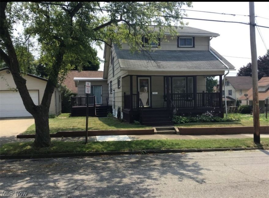 Great home! 4 bdrm., 2 bath Colonial, large living room, dining room, master bedroom with bath on the first floor. 3 car garage- 1 car attached, 2 1/2 car detached, deck, kitchen with appliances, natural woodwork, front porch, on a corner lot.