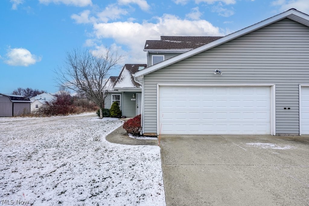 Is your ideal residence a low maintenance move-in ready condo in a rural setting? Then look no further than 4251 Pine Drive! This nicely updated home is within 1 mile of NEOMED with quick access to I-76! This end-unit home features an open concept floor plan including a great room with vaulted ceilings and newer vinyl plank flooring extending throughout the dining room and fully equipped kitchen. Enjoy the convenience of a first-floor bedroom and a full bath with shower stall and newer sink, as well as a laundry room attached to the large 2 car garage. Upstairs are two additional bedrooms with another full Jack and Jill bathroom with newer vanity and sink. This end-unit home also features a nice patio to enjoy the private wooded views! Enjoy the ease of no basement worries, but plenty of closet space and storage above the garage! HOA fee includes snow removal, trash removal and landscaping. Don't miss out on this great opportunity in Rootstown Township with its lower taxes, but close