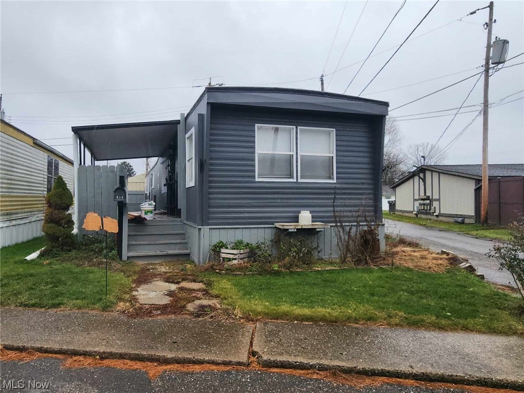 1 story living! 2 bedroom home with some updates. Covered front porch. Updated kitchen with concrete counters. Attached storage building. Agent owned. $225 monthly lot rent.