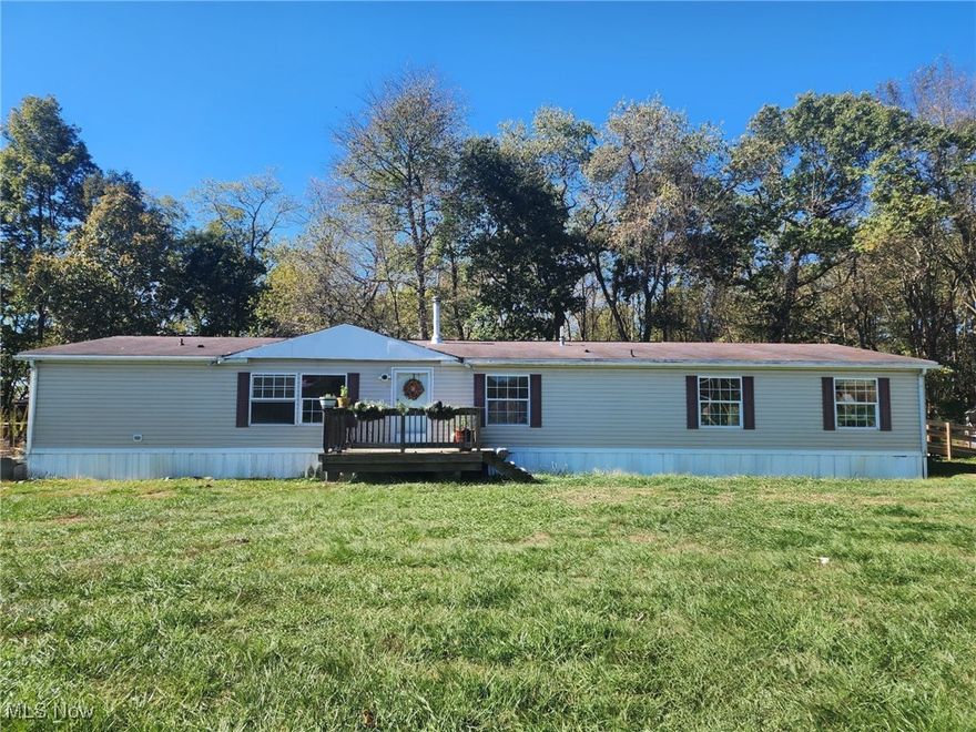 Four bedroom, three bath home nestled privately on a peaceful and quiet 2.08 acre mini farm that was a part of the historic Lake Marwin.  The overly generous master bedroom has his and her closets and corner tub, separate shower and two independent sink areas make up the master bath.  Attached is a flex space appropriate for a nursery, study, or kitchen pantry.  The formal living room, dining room and kitchen are open and connected. All appliances to stay includes 2 refrigerators, 2 year old stove, dishwasher and washer and dryer. Air conditioner is 1 year old, wood stove was installed in 2024  Property borders a farmers field and acres of unimproved nature.  While the road leading to the home is Township maintained, you'll feel as if you have it all to yourself.  Upon cresting the knoll, your greeted with a lush golf course-like lawn(seasonal).  Once you soak that in, you'll notice the 204 well kept manufactured home with 2500 sq ft.  Home is hurricane-strapped to a six inch professionally poured concrete pad in 2020.  Three stone lined fire pits established waiting for you to pull up a chair, unwind with family and experience daily sunsets. Propane tank is tucked away next to a secure chicken coop which comfortably houses ducks, chickens and turkeys.   pasture with a wired small barn There are two additional concrete pads, one is currently being used for livestock but can be converted back to the single wide trailer site due to the plumbing and electric still in place.   3rd pad is wired and plumbed for a camp rental. single wide trailer, or small house for the grandparents.   The governor's driveway leads to a giant metal barn with a concrete floor and is wired in two places for 220 electric.  This lifted structure is large enough for a boat, car and any motorsports or farming equipment you need to keep out of the weather.  Currently being used for a welding shop and storage.  New electric service and two county water hook-ups.  also there are two septic systems.