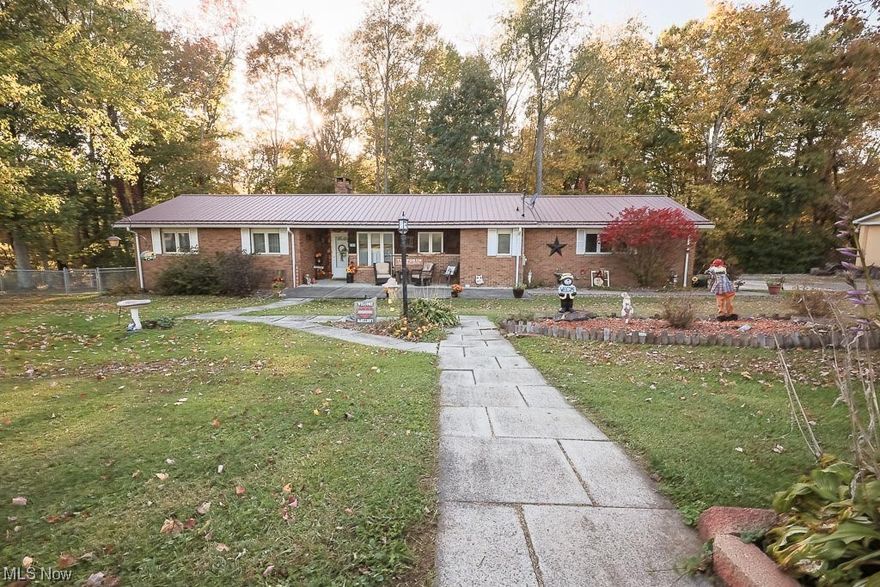 Nestled in the charming and sought-after community of Hopedale, this delightful single-family home offers a harmonious blend of comfort and convenience. With three bedrooms and two full baths, this home is designed to accommodate your needs effortlessly. The first-floor laundry adds to your everyday ease, with a fenced-in backyard. There is a 2-car attached garage but for those who appreciate space for their vehicles and hobbies, there is an impressive 36' x 30' detached garage with a solid concrete floor and electric.   The exterior boasts new siding, a new metal roof, soffit, and fascia, providing peace of mind for years to come. Stay warm and cozy with a furnace that's just around 5 years old. Situated in a highly desirable Hopedale location, this property enjoys the serenity of woods behind the home, creating a tranquil oasis. Inside, the finished basement beckons with a wood-burning fireplace, while the living room also features its own fireplace, adding character and charm. The kitchen is fully equipped with appliances, including a stove, refrigerator, dishwasher and microwave making this home a turnkey home for the fortunate new owner. Just off the kitchen is a second full bath with a washer, and dryer for first floor convenience.  Don't miss your chance to experience the unique blend of comfort and practicality that this home offers – schedule your viewing today!