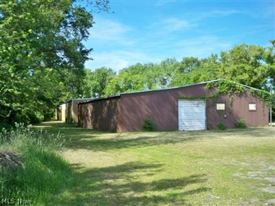 Two buildings on 1.49 acre. The first building was built in 1900 and is 3360 sq. ft. with 3-9ft. overhead doors, and a newer roof. Good storage building. The second building was built in 1965 and is 4992 sq. ft. and was previously used for light manufacturing. It has a newer roof and 3-phase electric. This building has 3-9 ft. overhead doors and has a finished office space, restroom, break area, air compressor room with air compressor, and lots of overhead lighting. Both of these buildings have 10' ceilings. Property enclosed by a 6 foot fence with two gate entrances. Plenty of room for parking or outdoor storage. Sits just on the edge of Barberton at the on ramp to I-76 East.