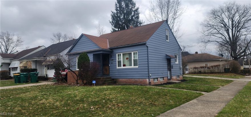 Charming Maple Heights Bungalow on a corner lot. Attached garage, newer roof, windows, furnace and electrical.