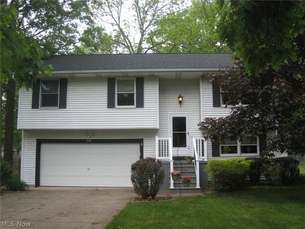 Wow! Many updates make this home move in ready! Cathedral ceilings enhance this spacious living, dining and kitchen area. Beautiful Corian counter tops and ceramic backsplash, stainless steel appliances, pantry and great cabinet space make this a chef's dream. The sliding glass door walks out to the upper deck that overlooks the fenced, landscaped and treed yard. There's a shed, too! A perfect area for entertaining inside and out. Three good size bedrooms with closet organizers. Updated bath also opens to the master bedroom. The lower level features a recreation room which walks out to the lower deck. An updated half bath, too. Enter the oversized 2 car attached garage here. Updates include: Roof, furnace and central air 2012, stainless steel appliances, baths, ceiling fans and some lighting fixtures. Carpets just cleaned throughout. Beautiful! Move in condition!
