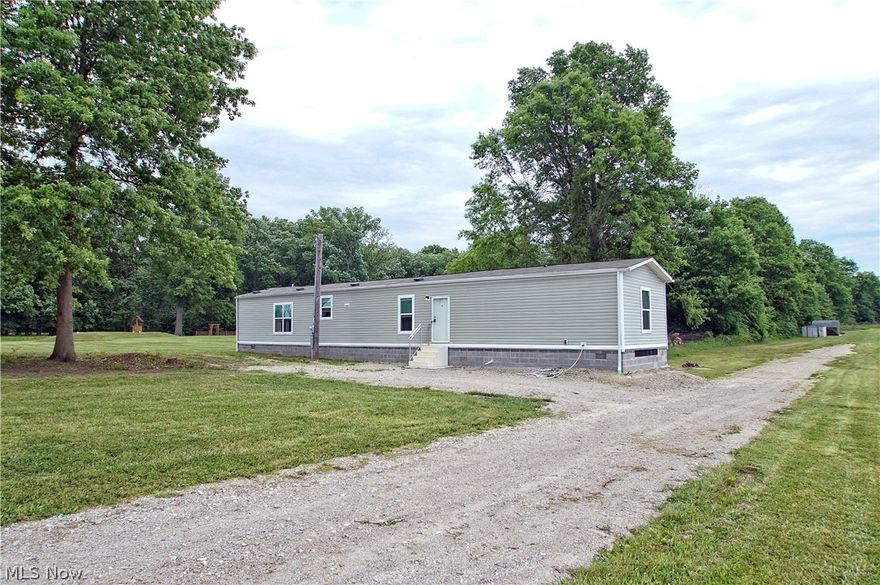 WOW! 2018 Built Manufactured home that has been installed on a permanent foundation, so this is classified as a residential home for lending purposes! Home has 3 bedrooms, 2 full baths, kitchen, living room, plus laundry room! New HVAC system, new water filtration system + softener. Brand new septic system and new well! This home sits on over 7 acres of wooded land, perfect for just about anything you want to do with it!