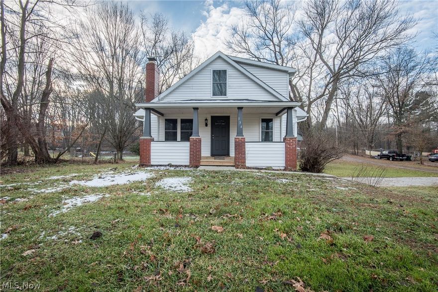 NICELY UPDATED CAPE COD IN GREEN SCHOOLS!  This turn-key home has so many great improvements, starting with a welcoming front porch with new decking.  Step into the living room with newer carpet, paint, and lighting plus a wood burning fireplace.  The renovated kitchen is amazing with cherry stained cabinets, glass tile backsplash, stainless steel appliances, hardwood laminate floor, and a spacious dining area.  A door from the kitchen opens to a balcony, great for grilling in the warmer months.  One of the bedrooms is nearby as well as the main bathroom with modern fixtures.  Upstairs, there are 2 generously sized bedrooms with great closet space, another updated full bathroom with linen closet and a large closet in the hall.  The basement has a laundry area with washer and dryer included, access to the garage and a walk-out to the backyard!  Improvements in the past 3 years include the kitchen & bathrooms, plumbing, electrical, carpet, paint, roof, HVAC, & water heater.  There is not